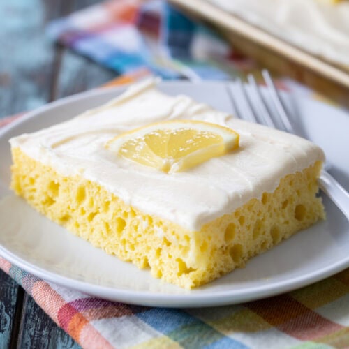 slice of lemon sheet cake on a plate.