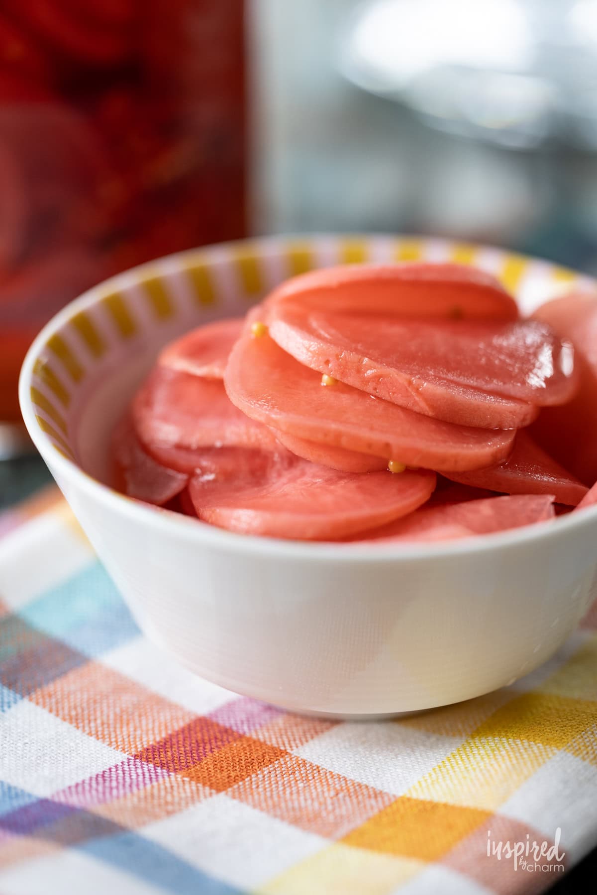Easy Pickled Radishes served in a small white bowl.