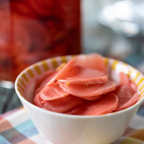 Easy Pickled Radishes in a small dish on a napkin.