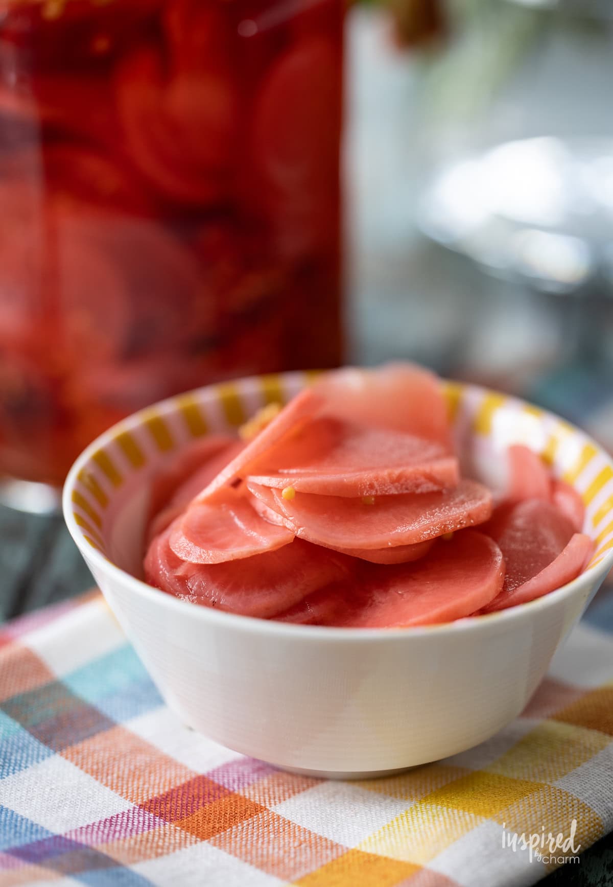 Easy Pickled Radishes in a small dish on a napkin.
