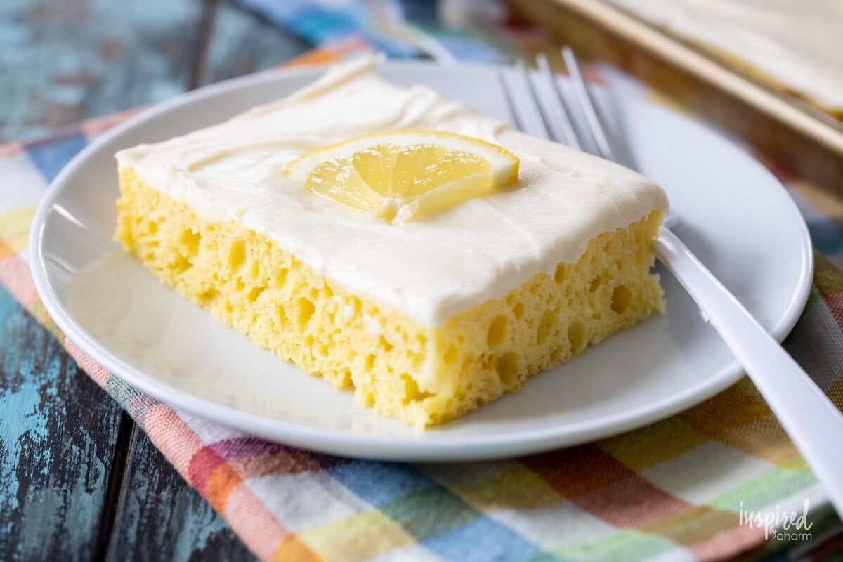 slice of lemon cake on a small white plate.