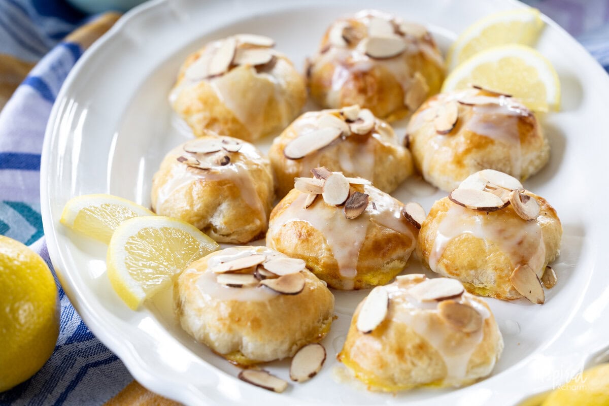 array of Lemon Almond Cream Cheese Puff Pastries on a plate.