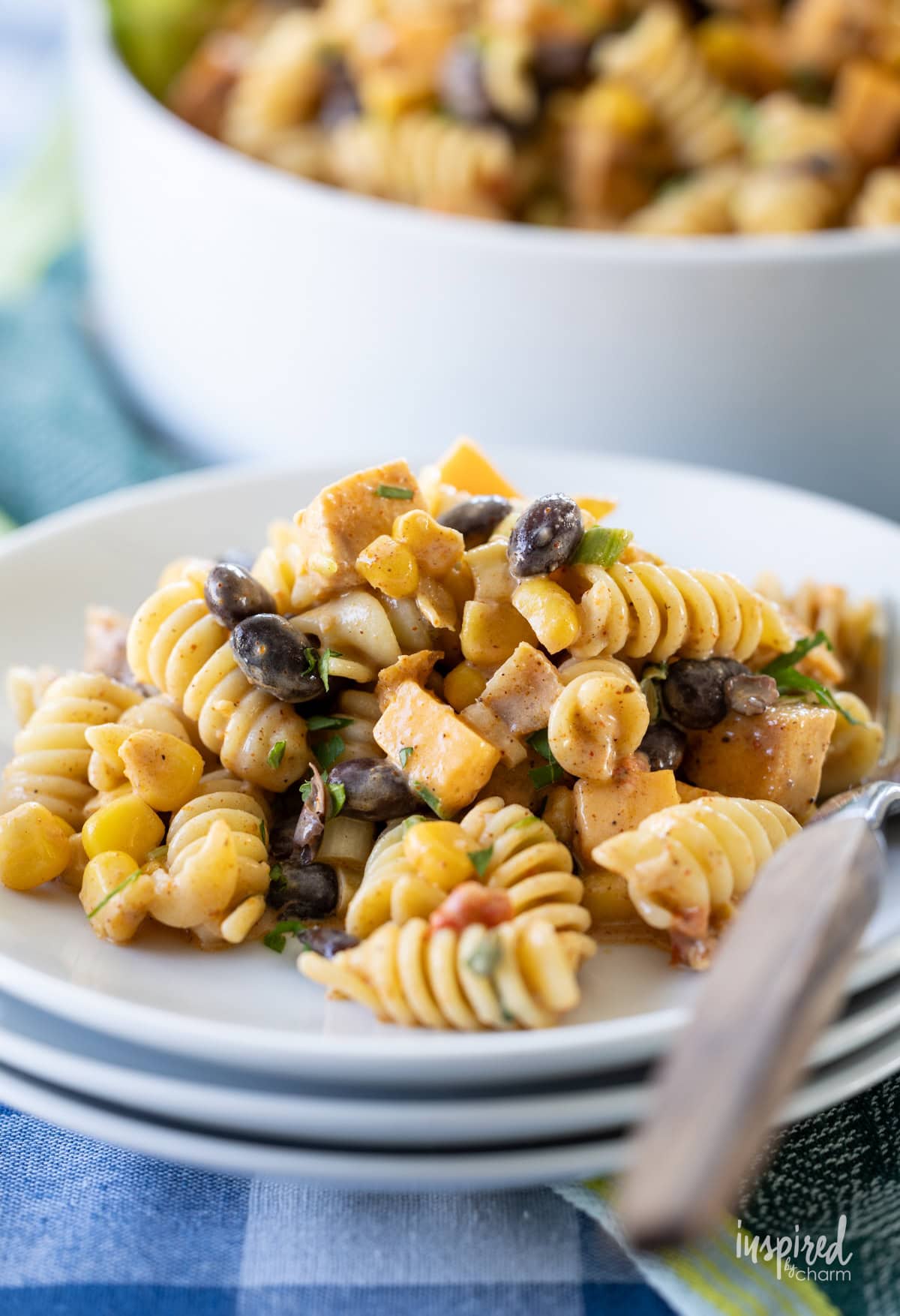 small plate filled with Southwest Chicken Pasta Salad and a fork. 