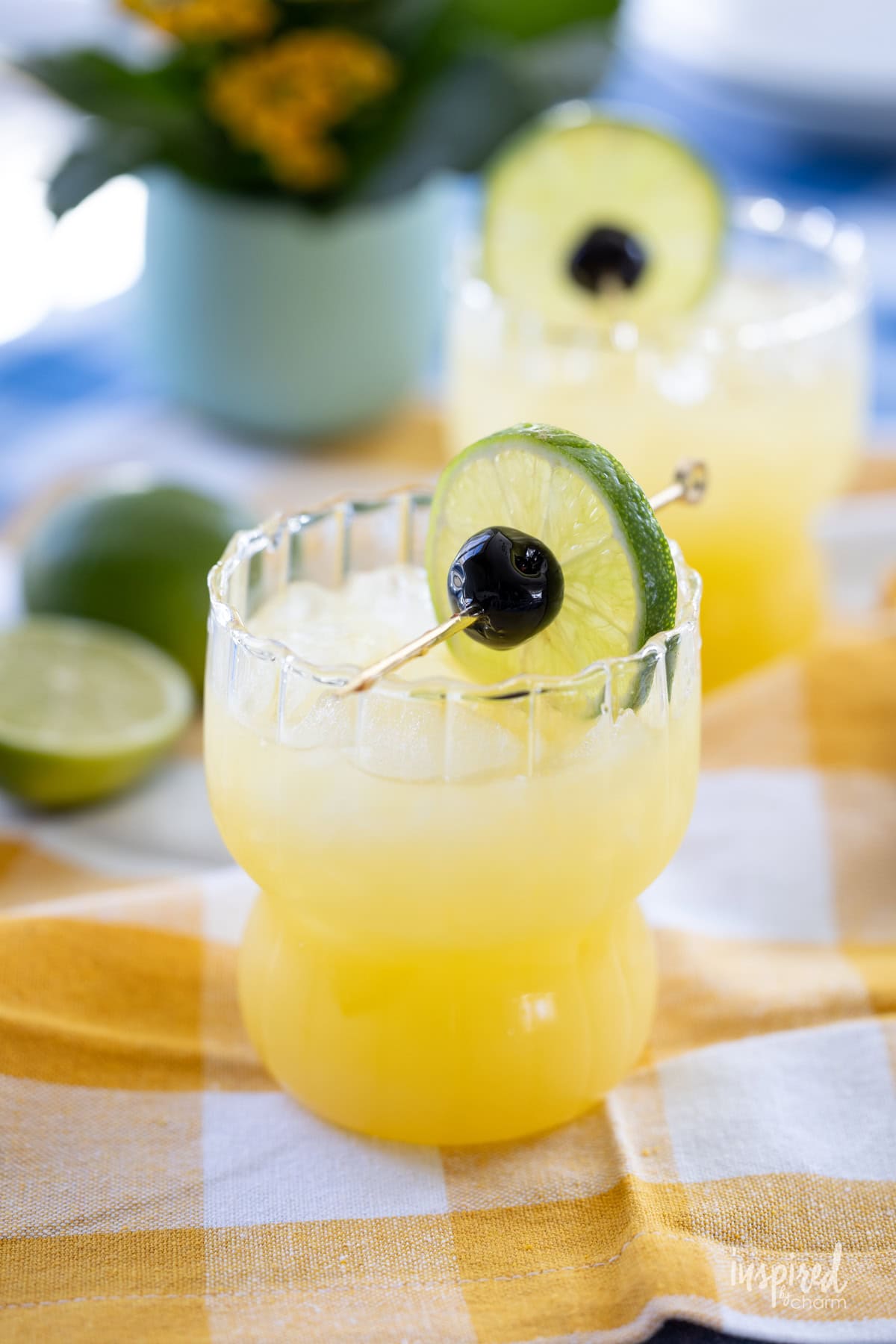 Black Eyed Susan Cocktail served on yellow gingham napkin. 