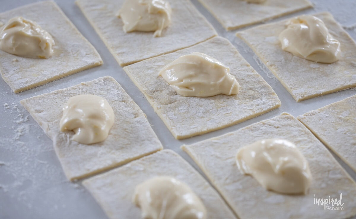 puff pastry squares with lemon curd and cream cheese filling.