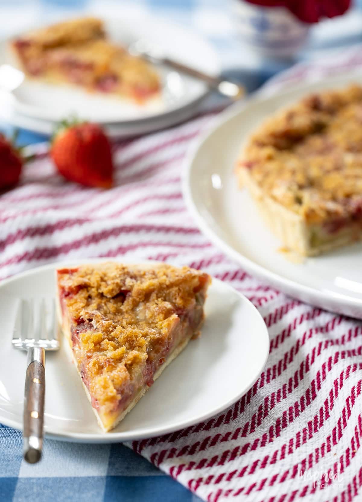 Strawberry Rhubarb Tart slices served on small plates. 