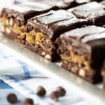 Peanut Butter and Fudge Brownies on a white platter.