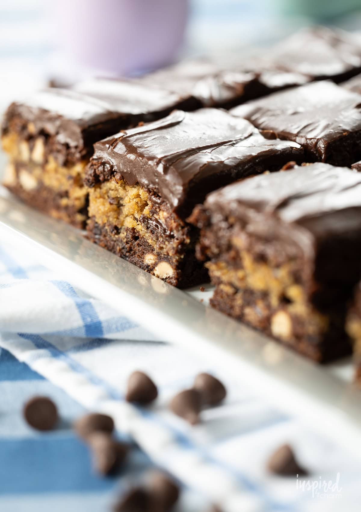 Peanut Butter and Fudge Brownies on a white platter.