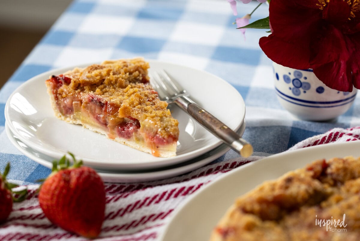 slice of Strawberry Rhubarb Tart on a small plate. 