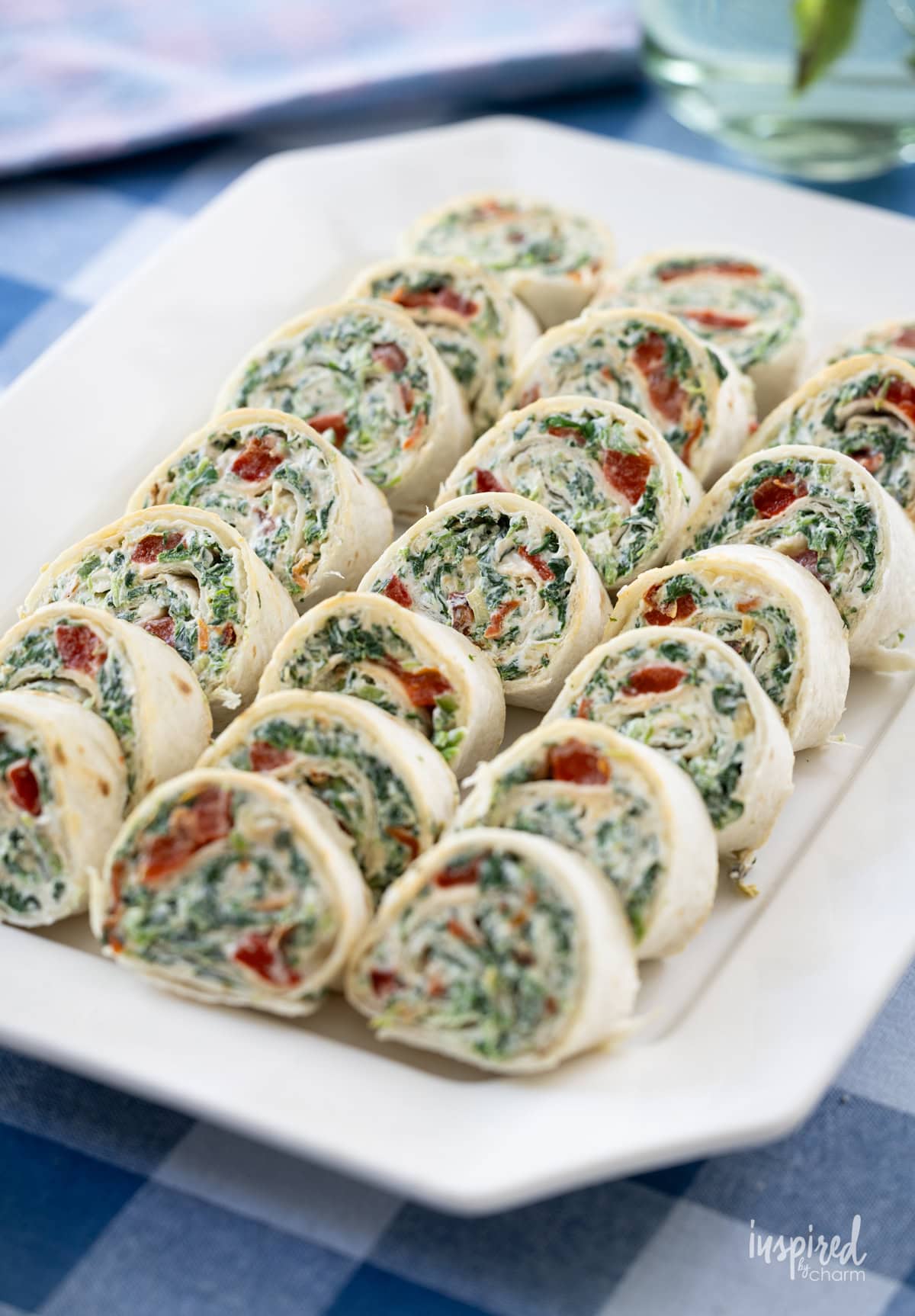 rows of Spinach Dip Roll-Ups on a plate.