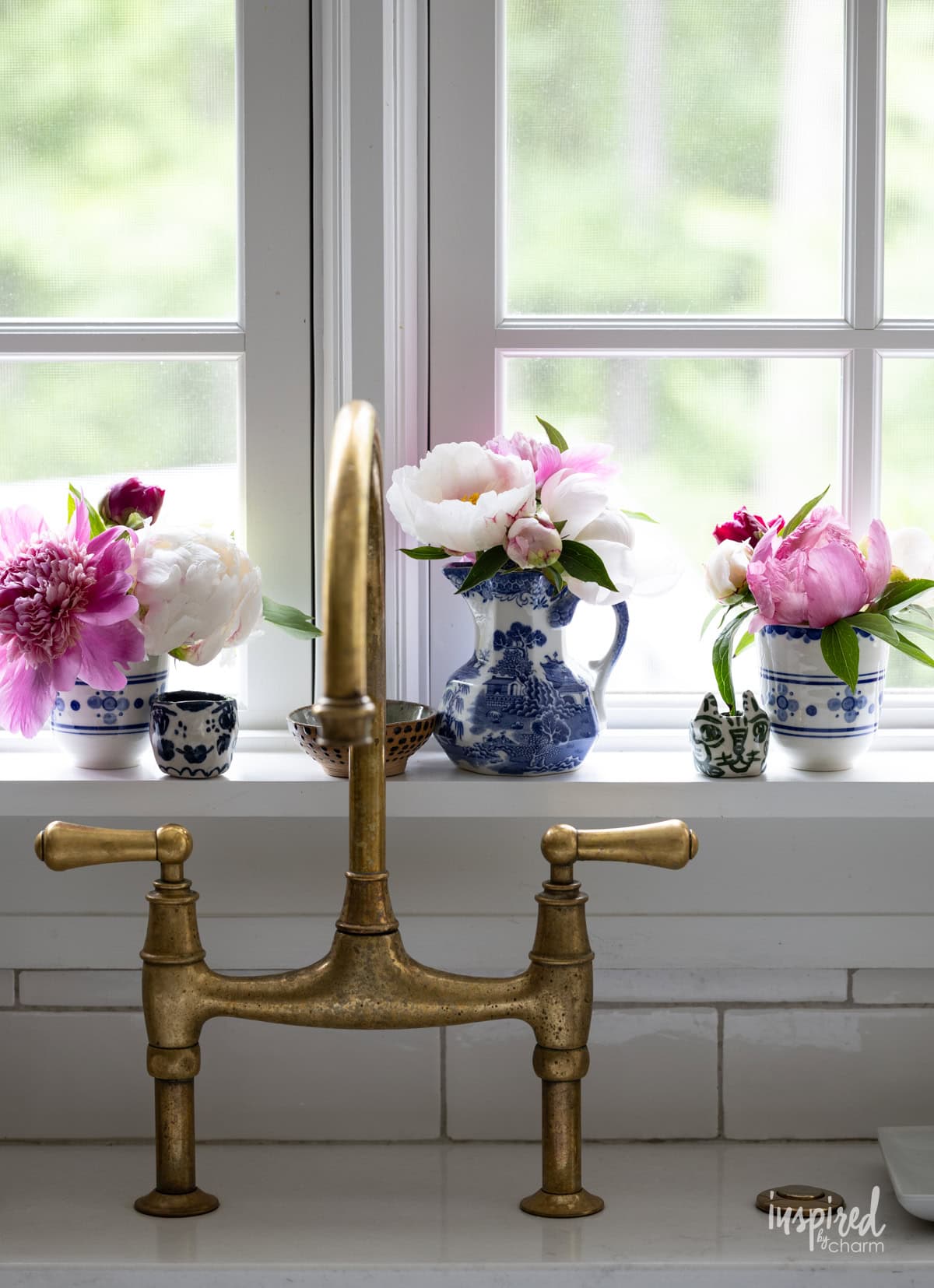 three vessels decorated with peonies. 