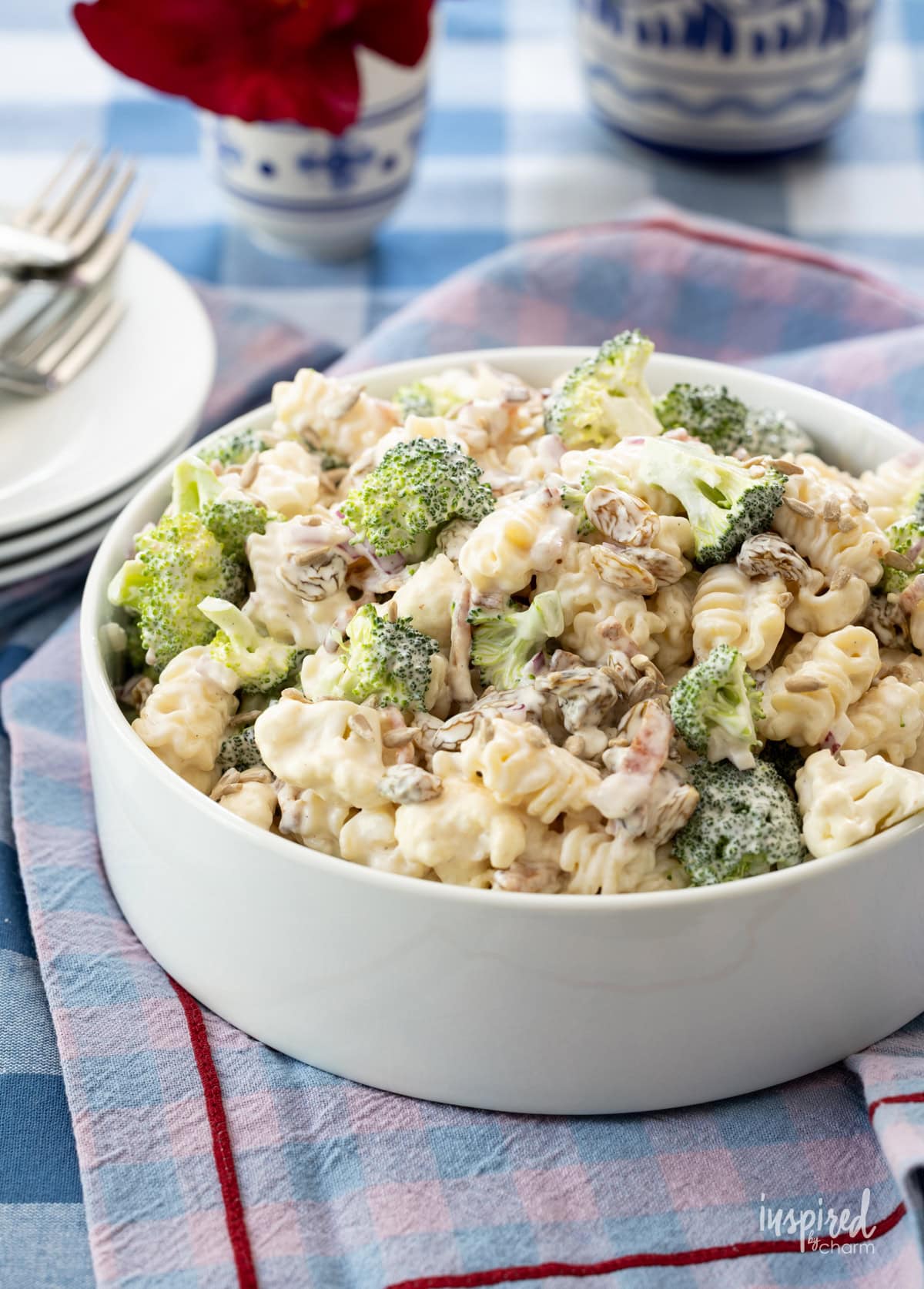 bowl of broccoli pasta salad on a table.