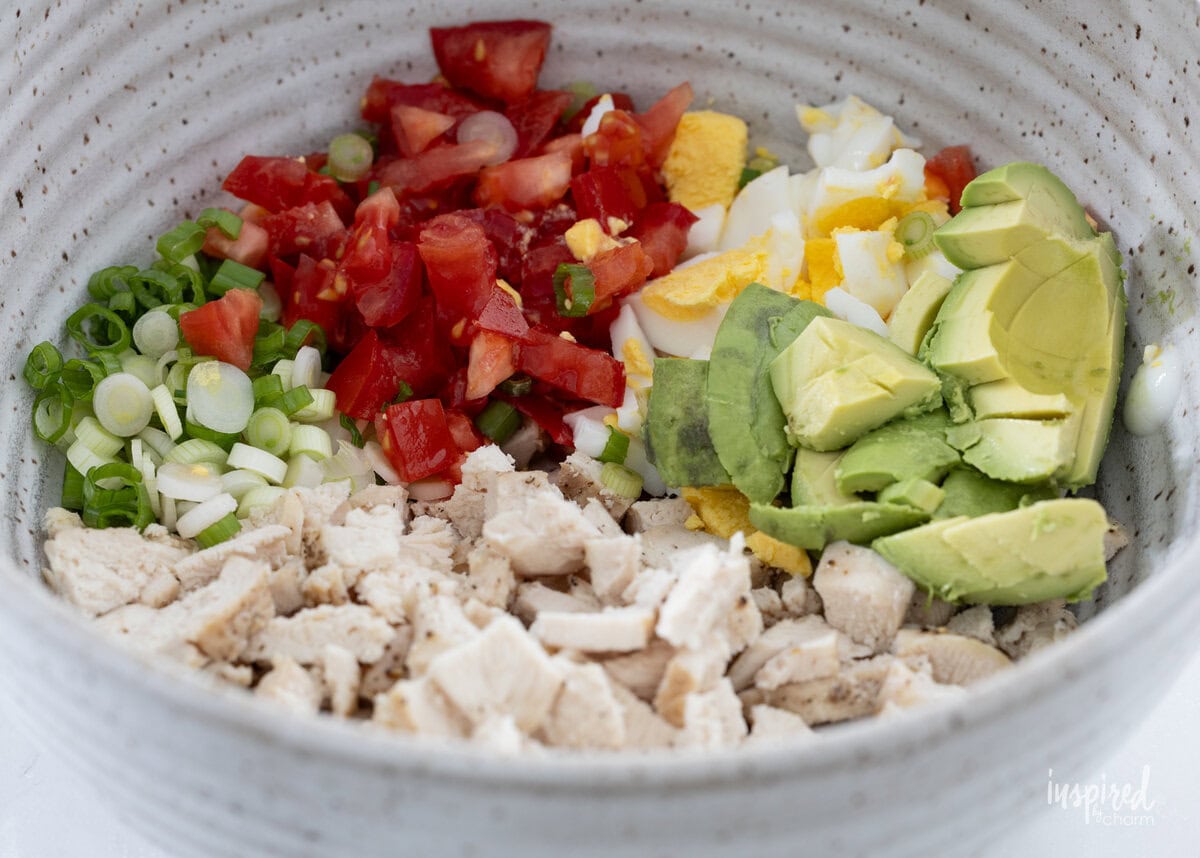 Cobb salad ingredients in a bowl.