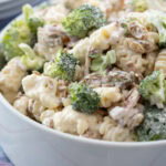 white bowl filled with Broccoli Pasta Salad.