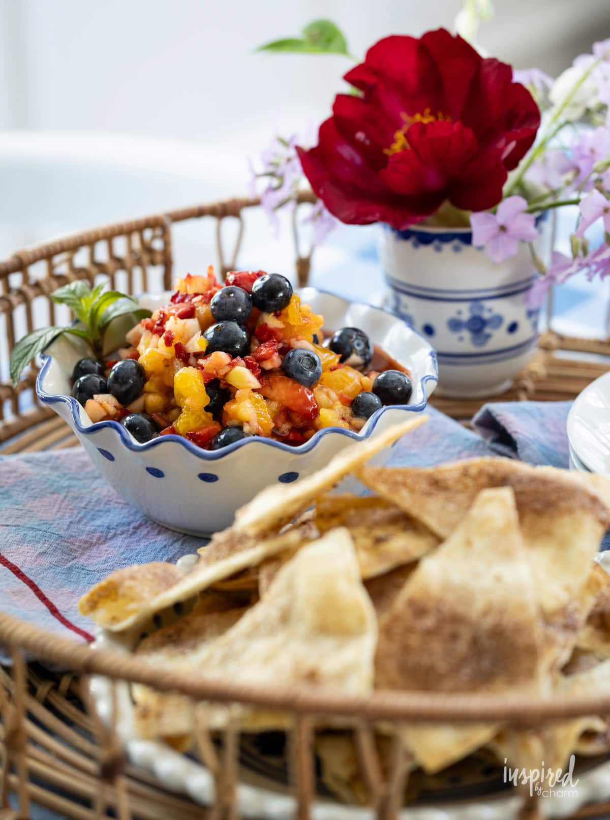fruit salsa served with tortilla chips in bowls on a table.