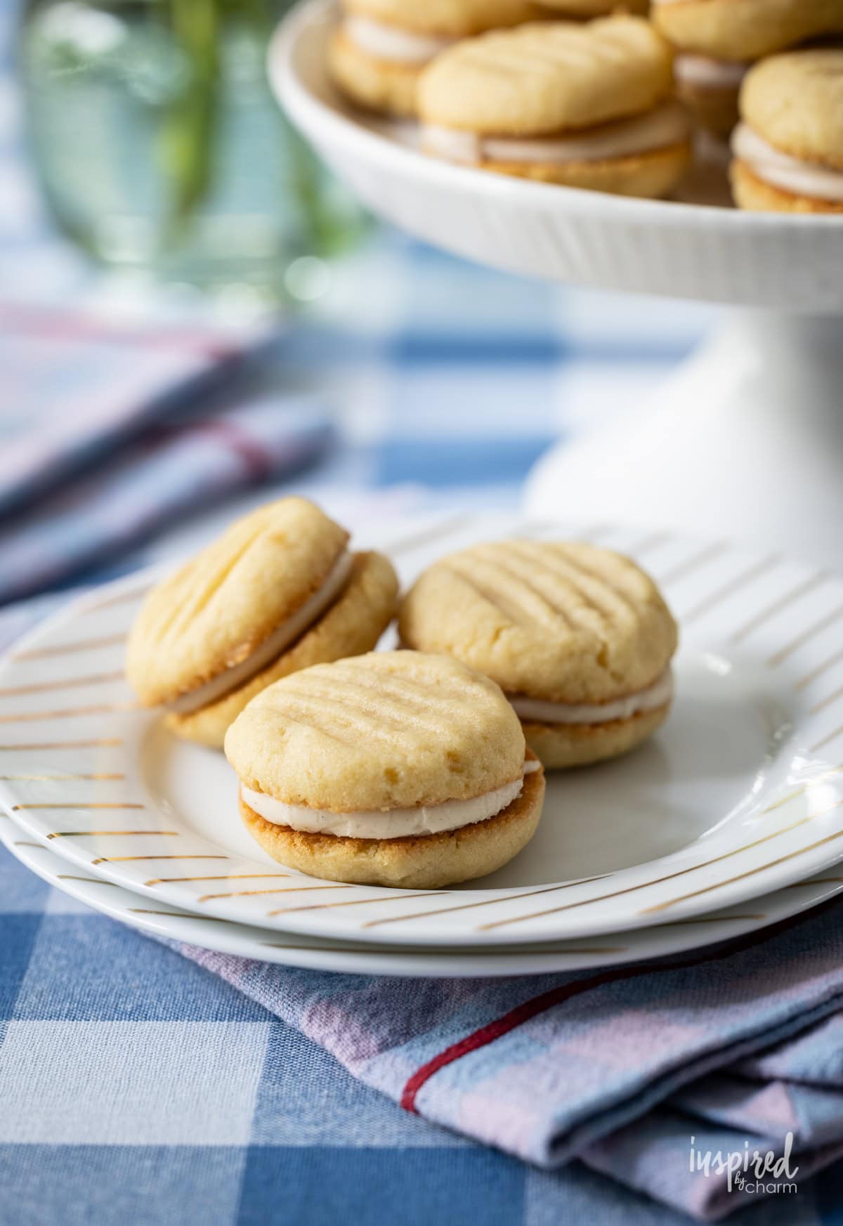 three Brown Sugar Cream Sandwich Cookies on a plate.