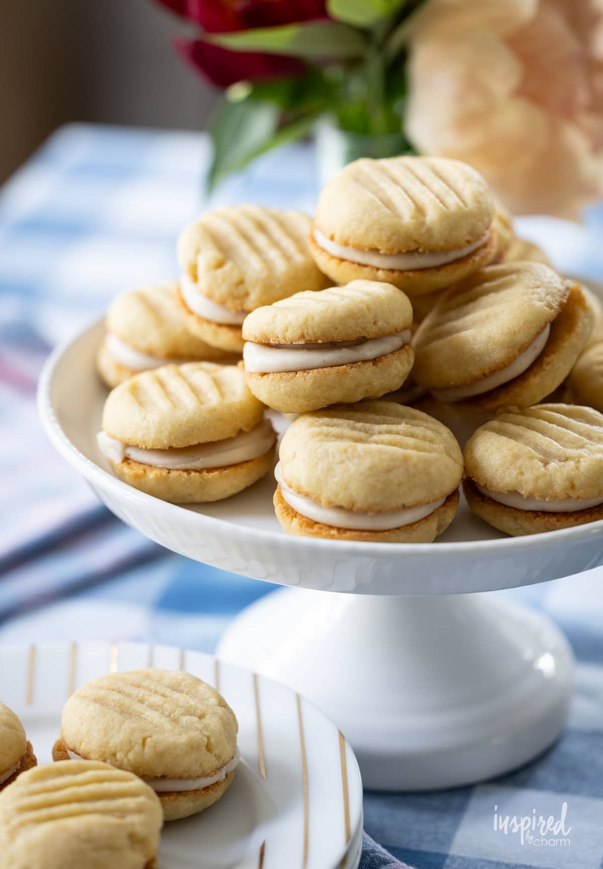 Brown Sugar Cream Sandwich Cookies on white cake stand.