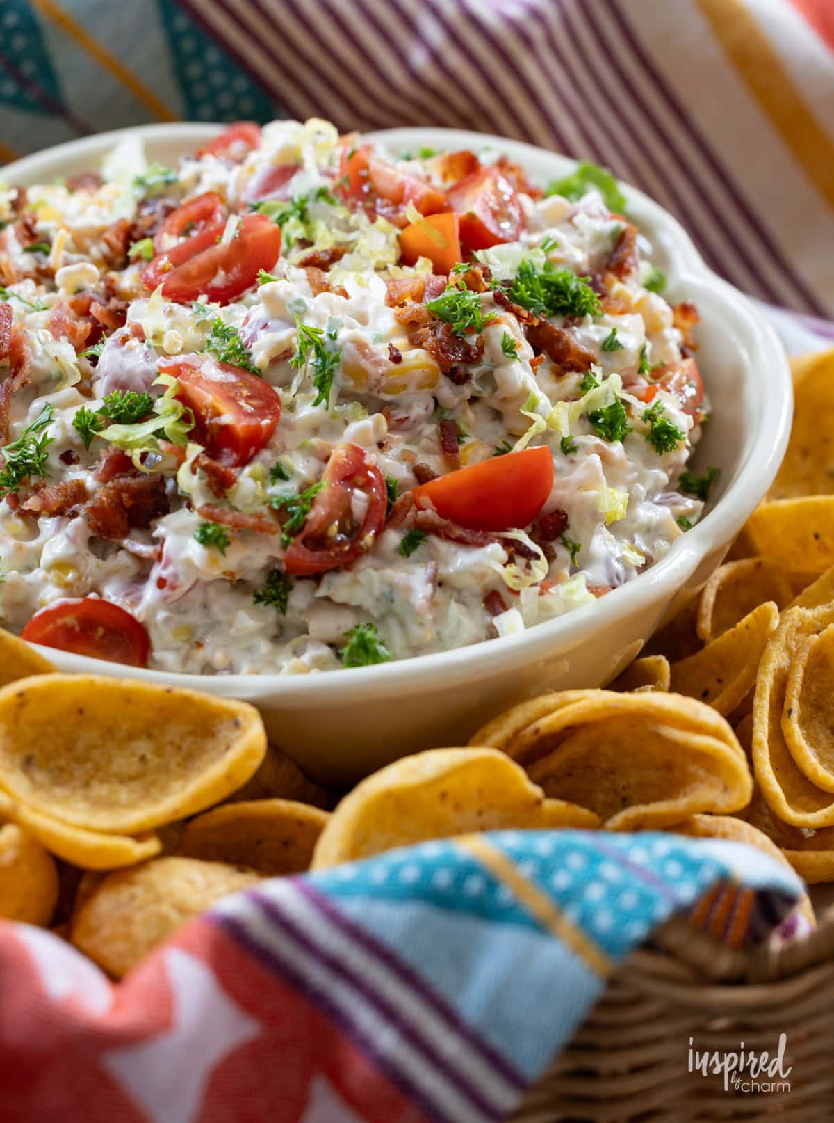 BLT Corn Dip served in a bowl with Fritos.