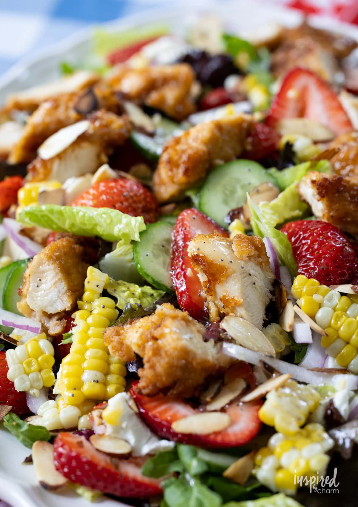 Large platter filled with Crispy Chicken Strawberry Corn Salad.