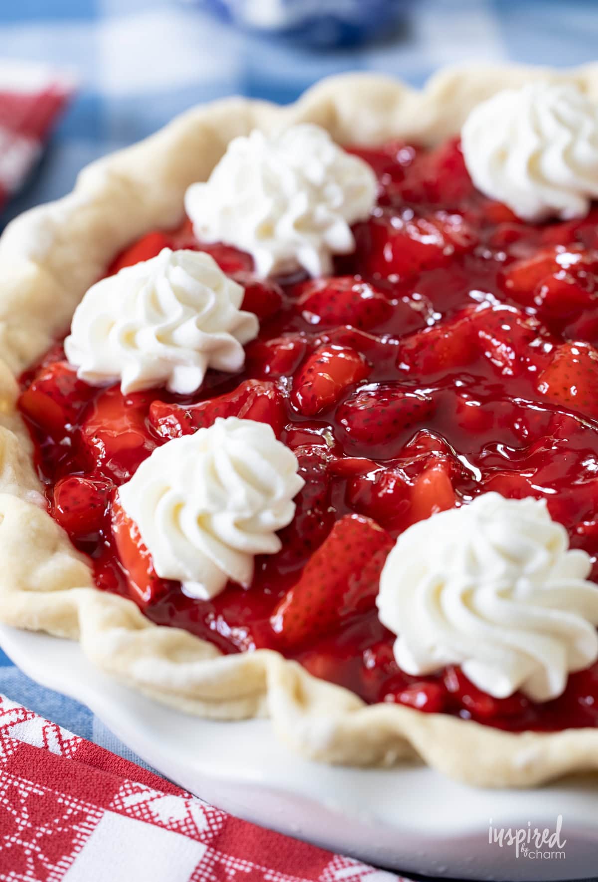 whole black bottom strawberry pie in pie dish on a table.
