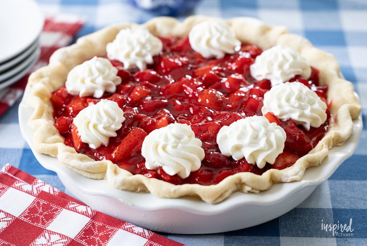 whole Black Bottom Strawberry Pie on checker tablecloth.