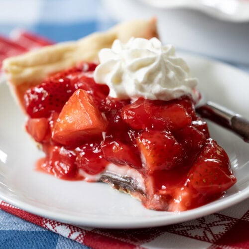 slice of Black Bottom Strawberry Pie on a plate.