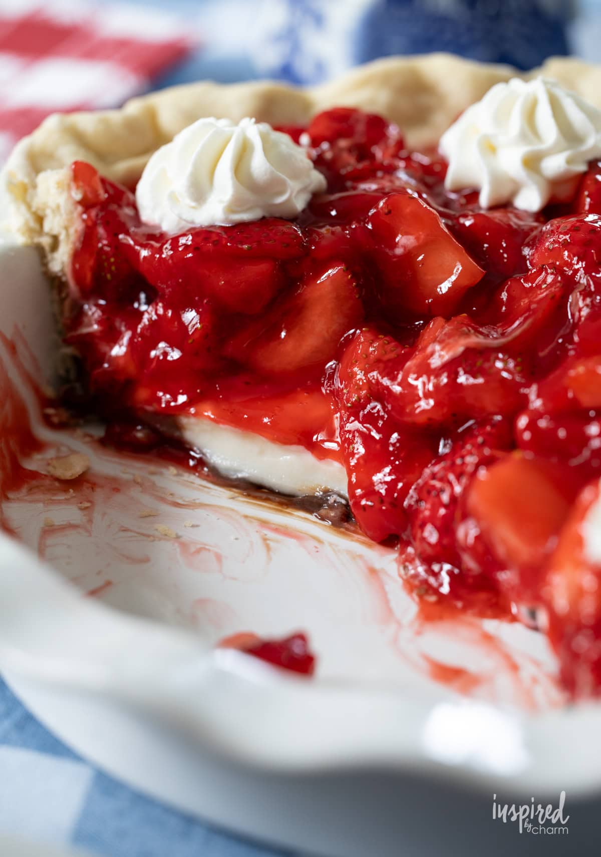 Black Bottom Strawberry Pie in white pie dish with sliced removed.
