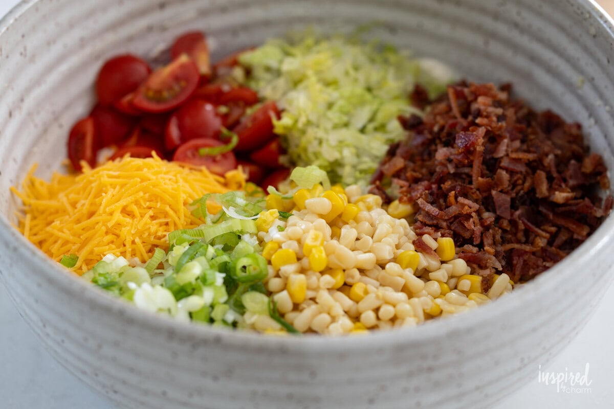 ingredients in a bowl for BLT Corn Dip.