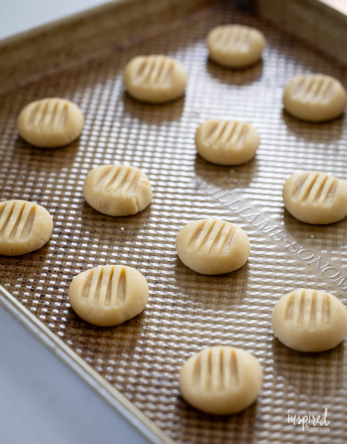 unbaked cookies on cookie sheet.