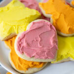 frosted sugar cookies on a plate.
