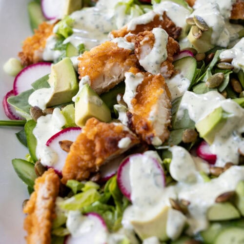 platter filled with Crispy Chicken Green Goddess Garden Salad.