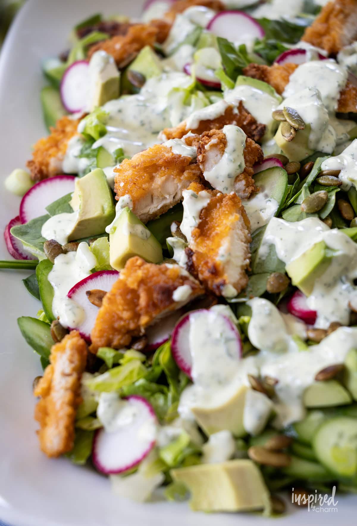 platter filled with Crispy Chicken Green Goddess Garden Salad.