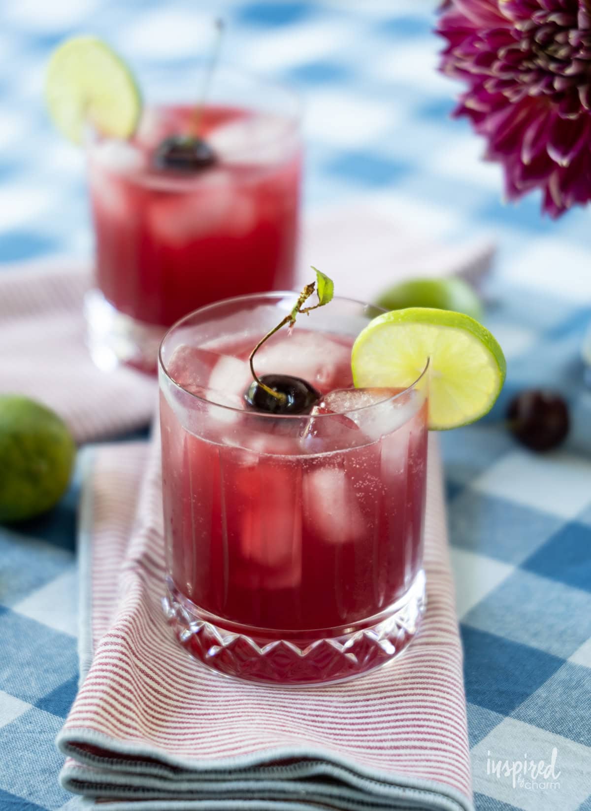 Cherry Pineapple Cooler drink on napkins.