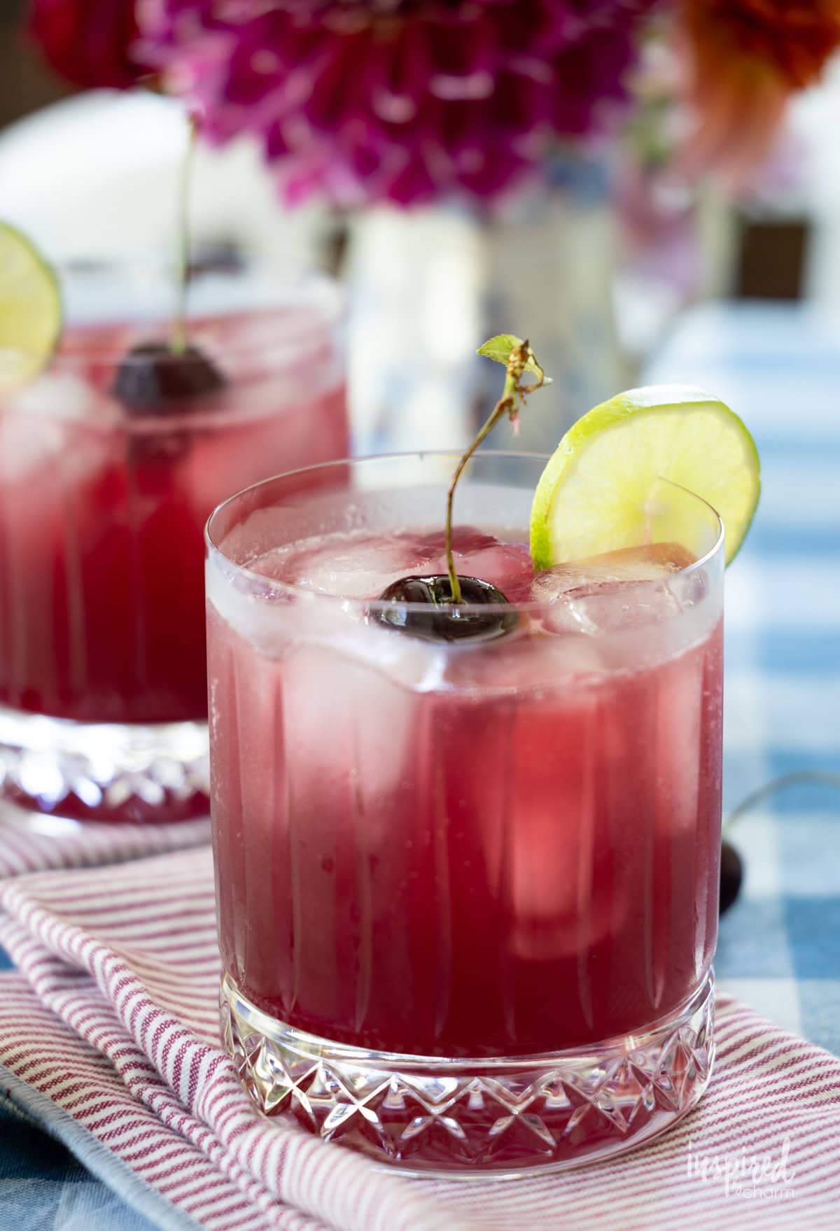 Cherry Pineapple Cooler cocktail / mocktail with cherry a and lime.
