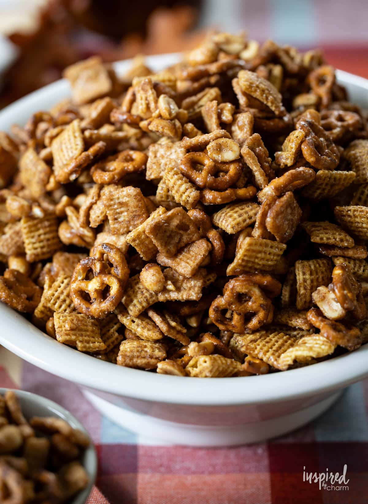 white bowl filled with Cinnamon Toast Pretzel Snack Mix.