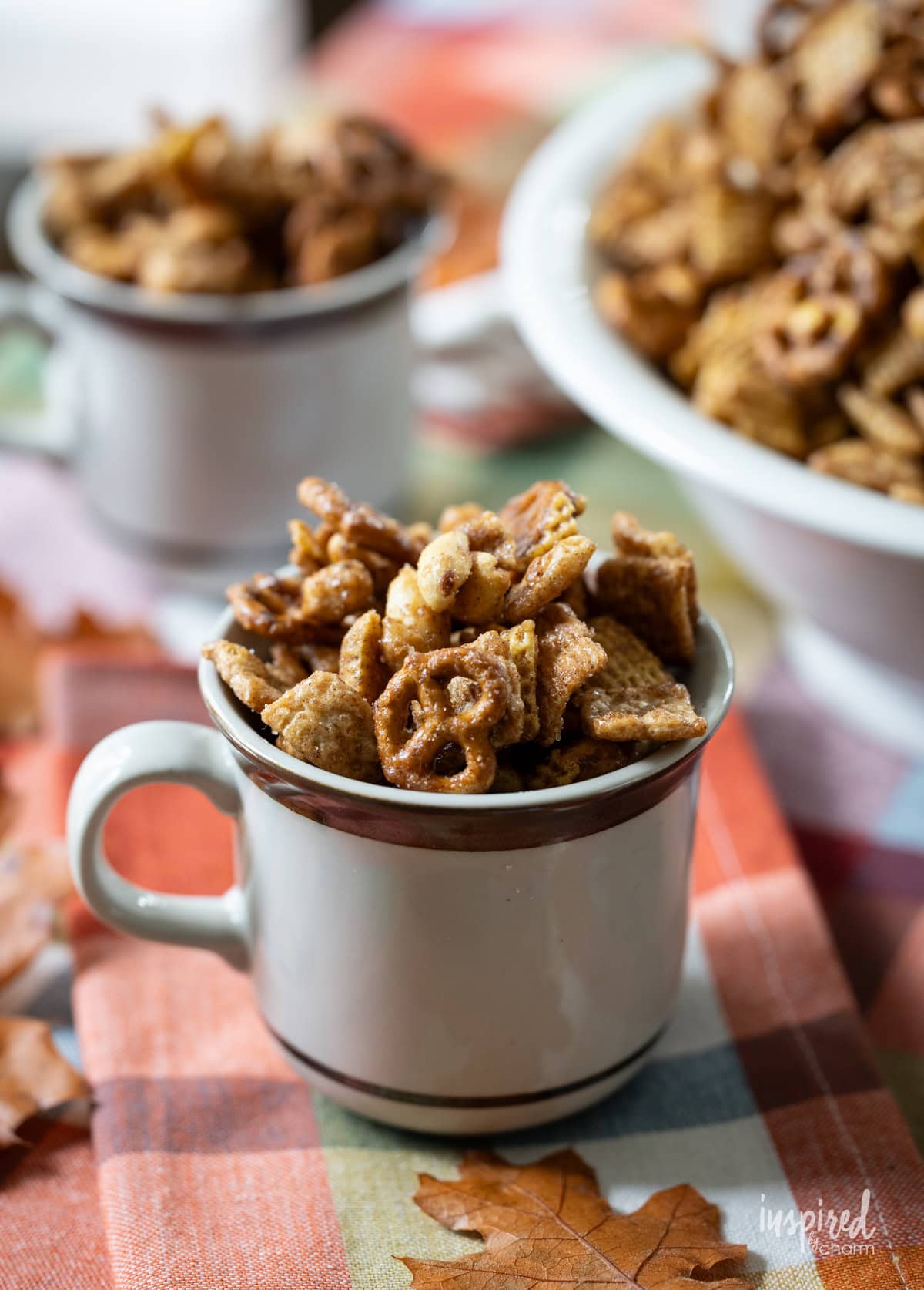 Cinnamon Toast Pretzel Snack Mix served in a mug.
