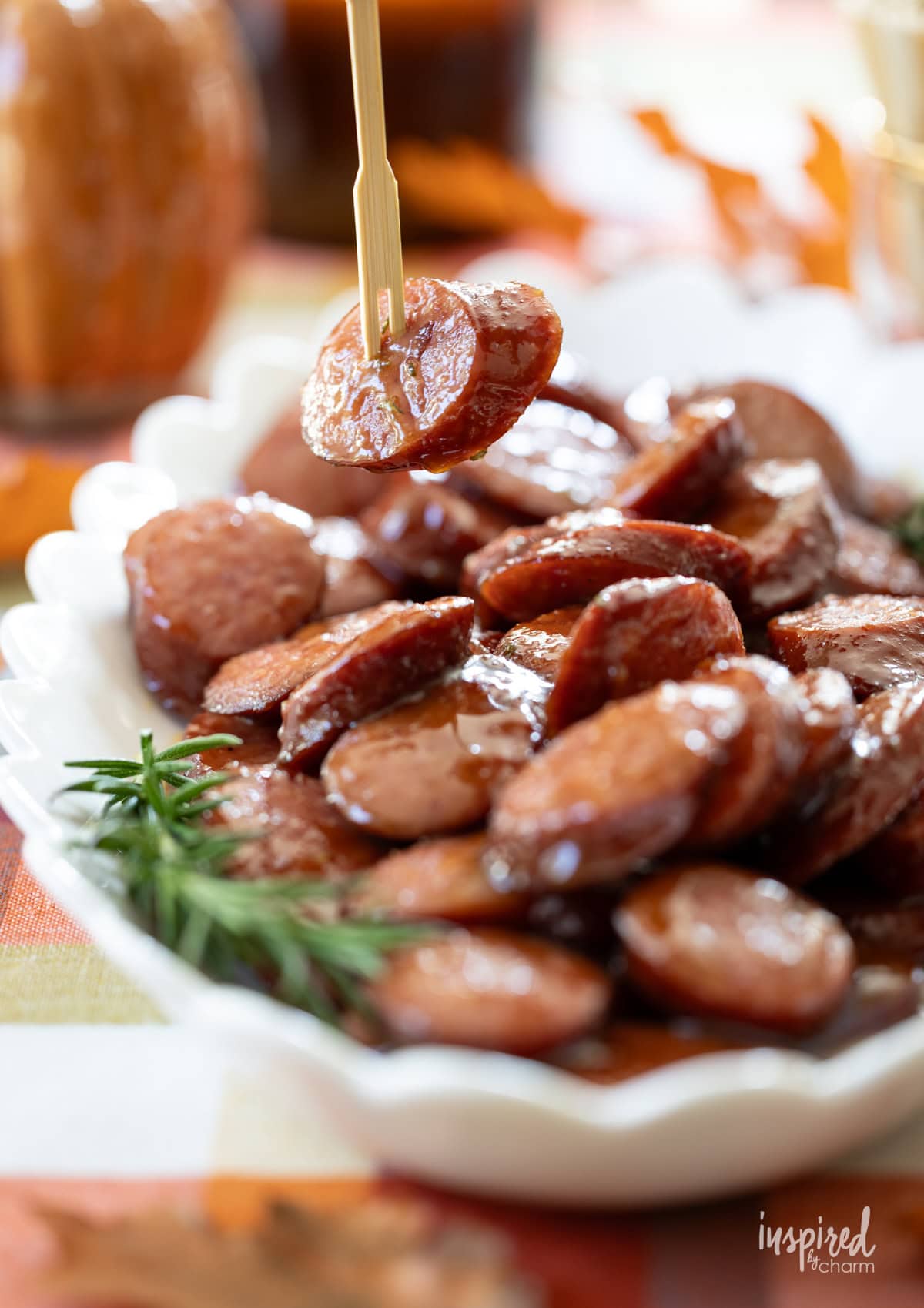 toothpick picking up maple dijon sausage bite.