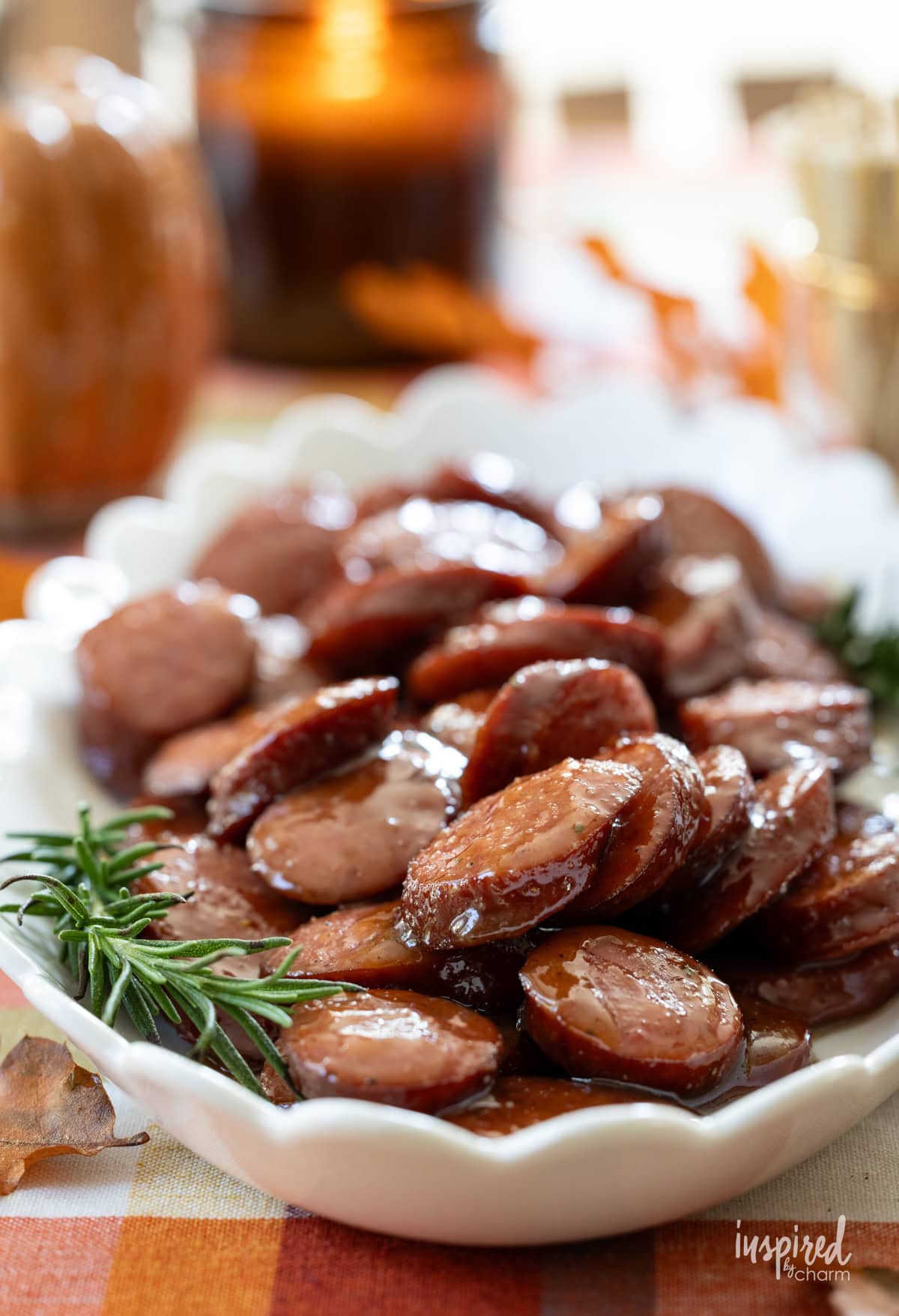 fall table set with a plate of maple dijon sausage bites.
