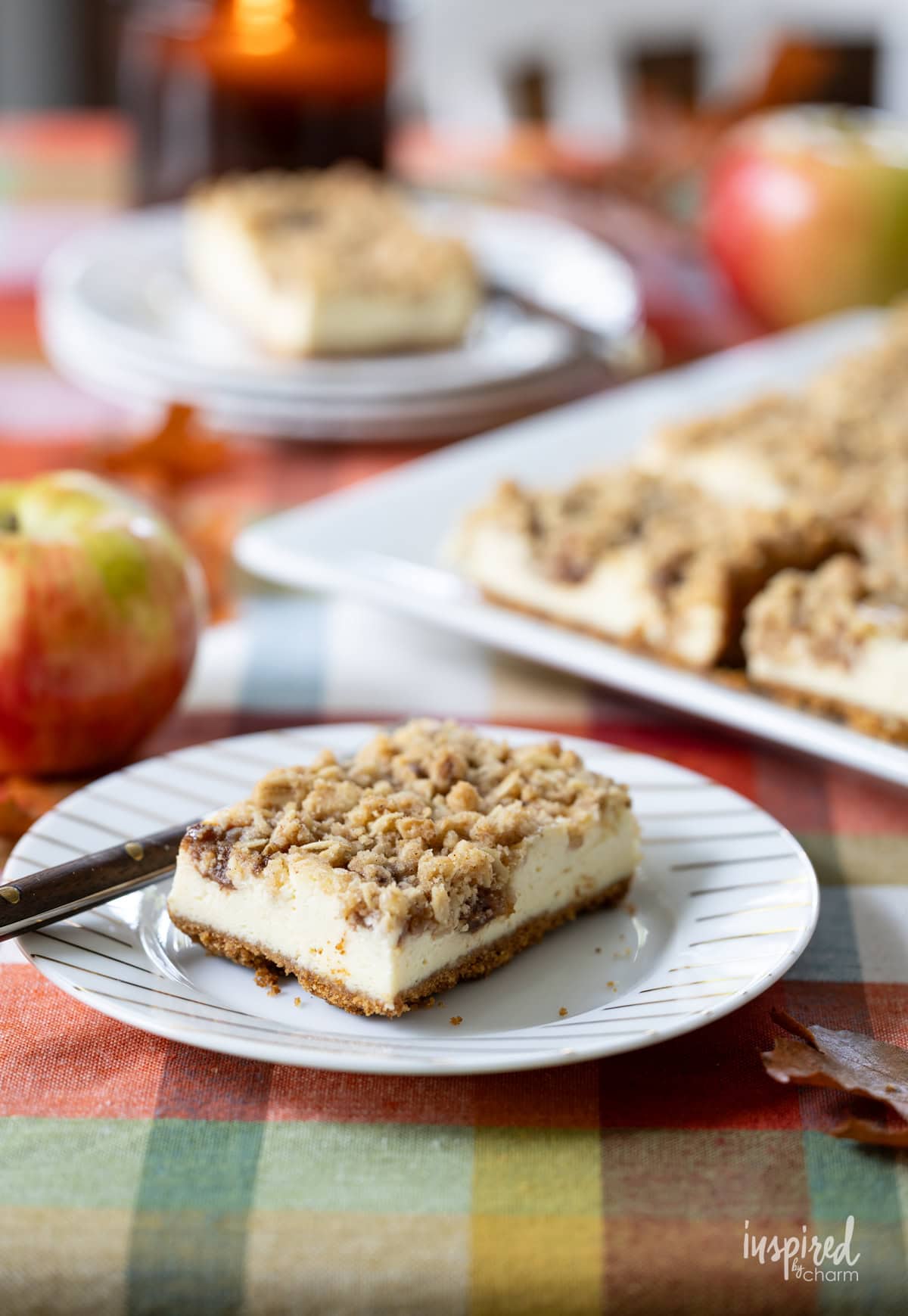Apple Butter Cheesecake Bars served on plate with a fork.
