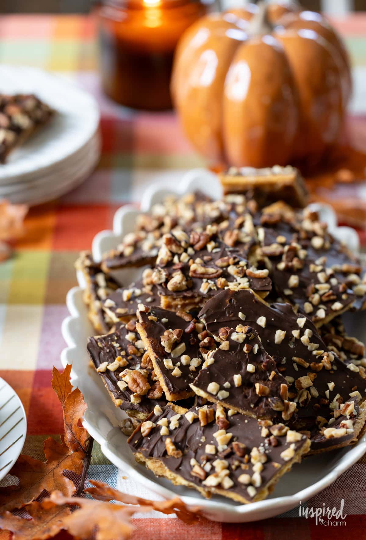 table with a platter of Pumpkin Spice Cracker Toffee.