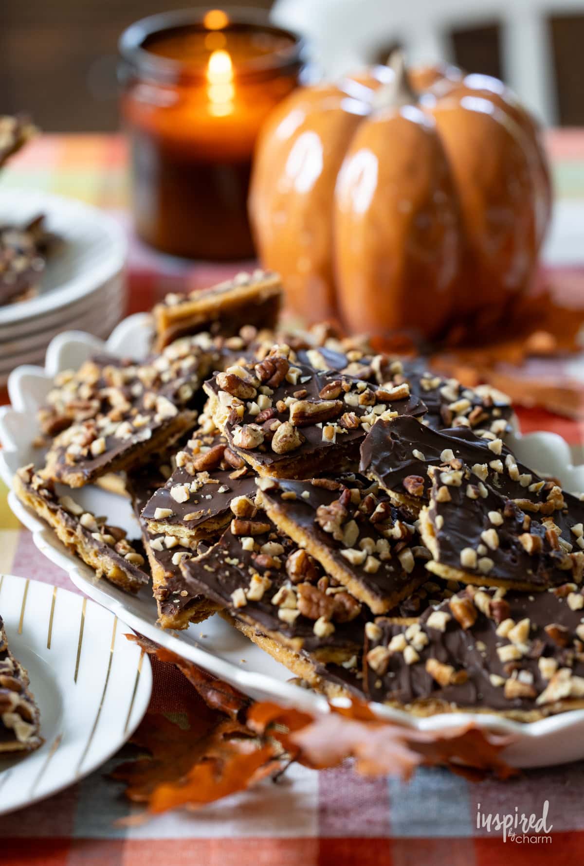fall table with plate of Pumpkin Spice Cracker Toffee.