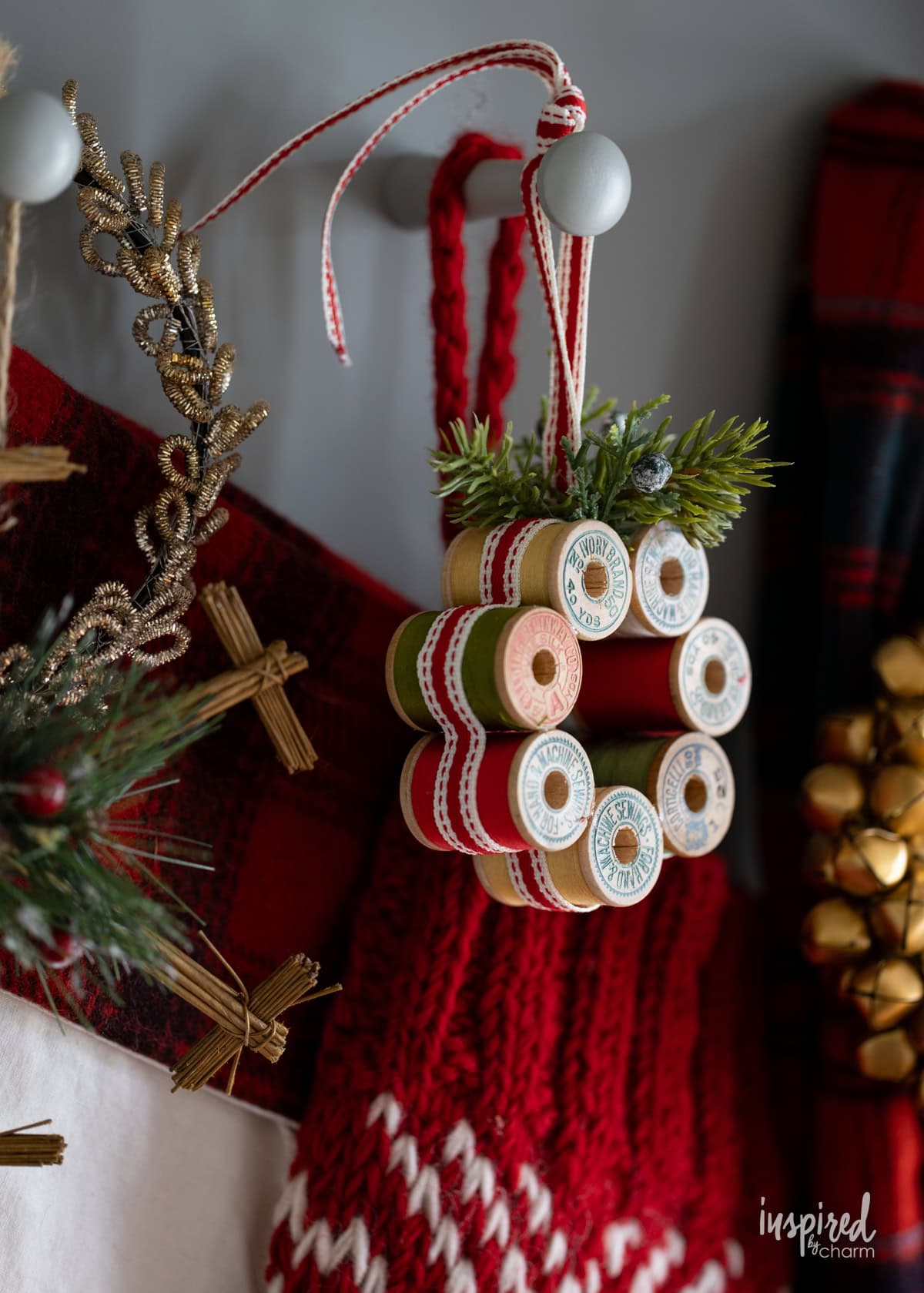 Vintage Thread Spool Mini Wreath hung on with stockings.