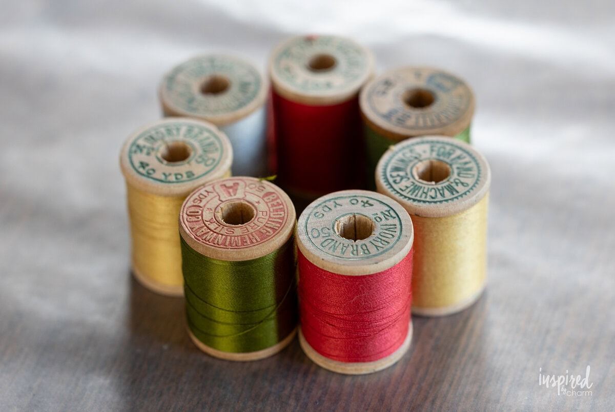 vintage thread spools on a piece of waxed paper.