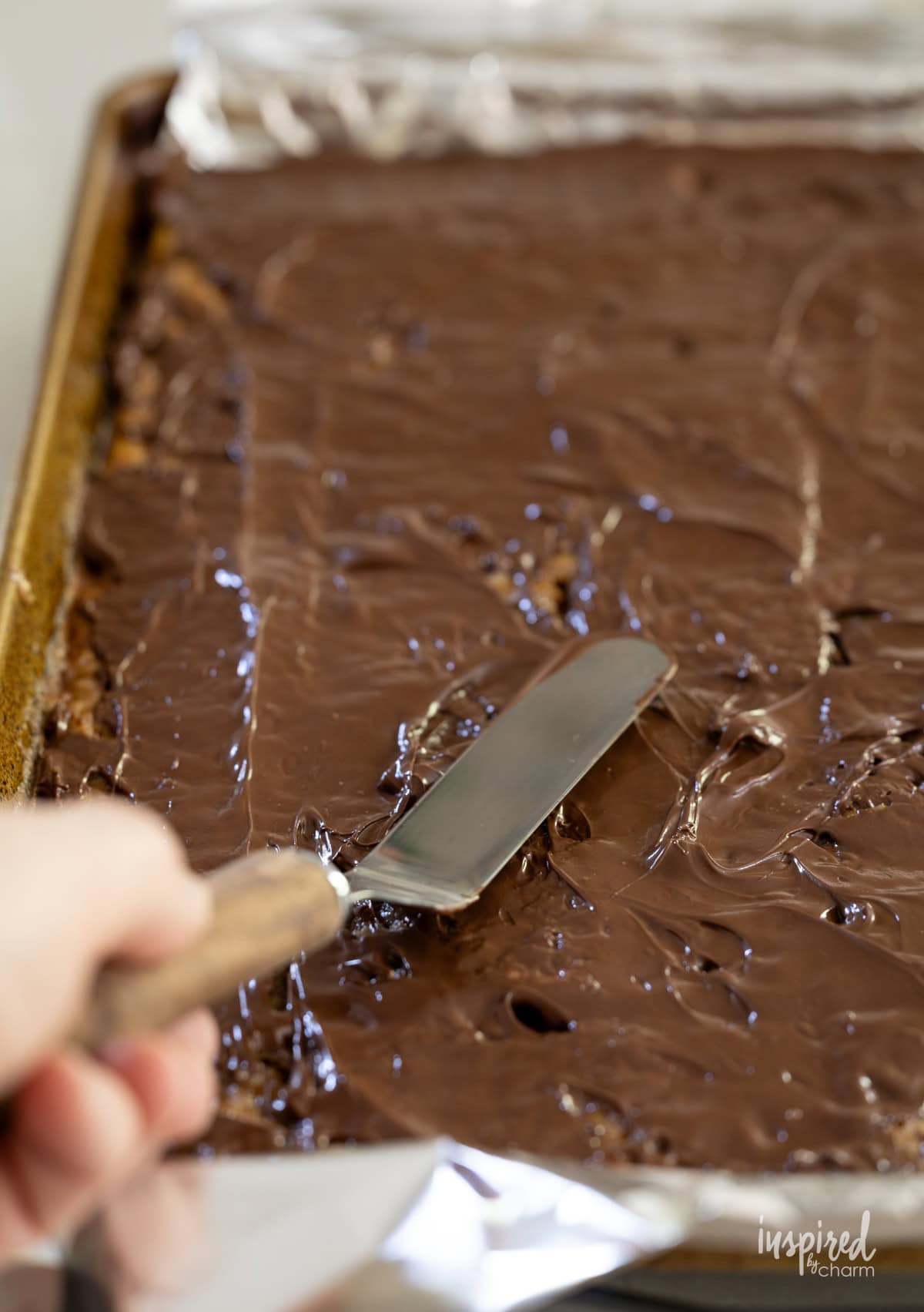 offset spatula spreading out chocolate. 