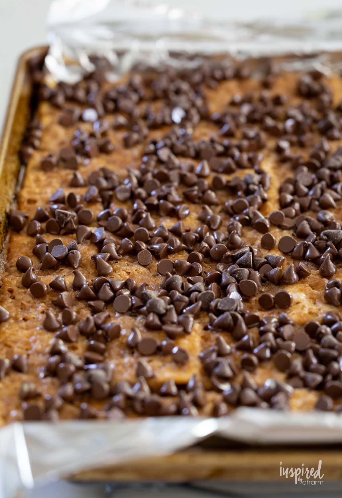 chocolate chips on hot toffee crackers.