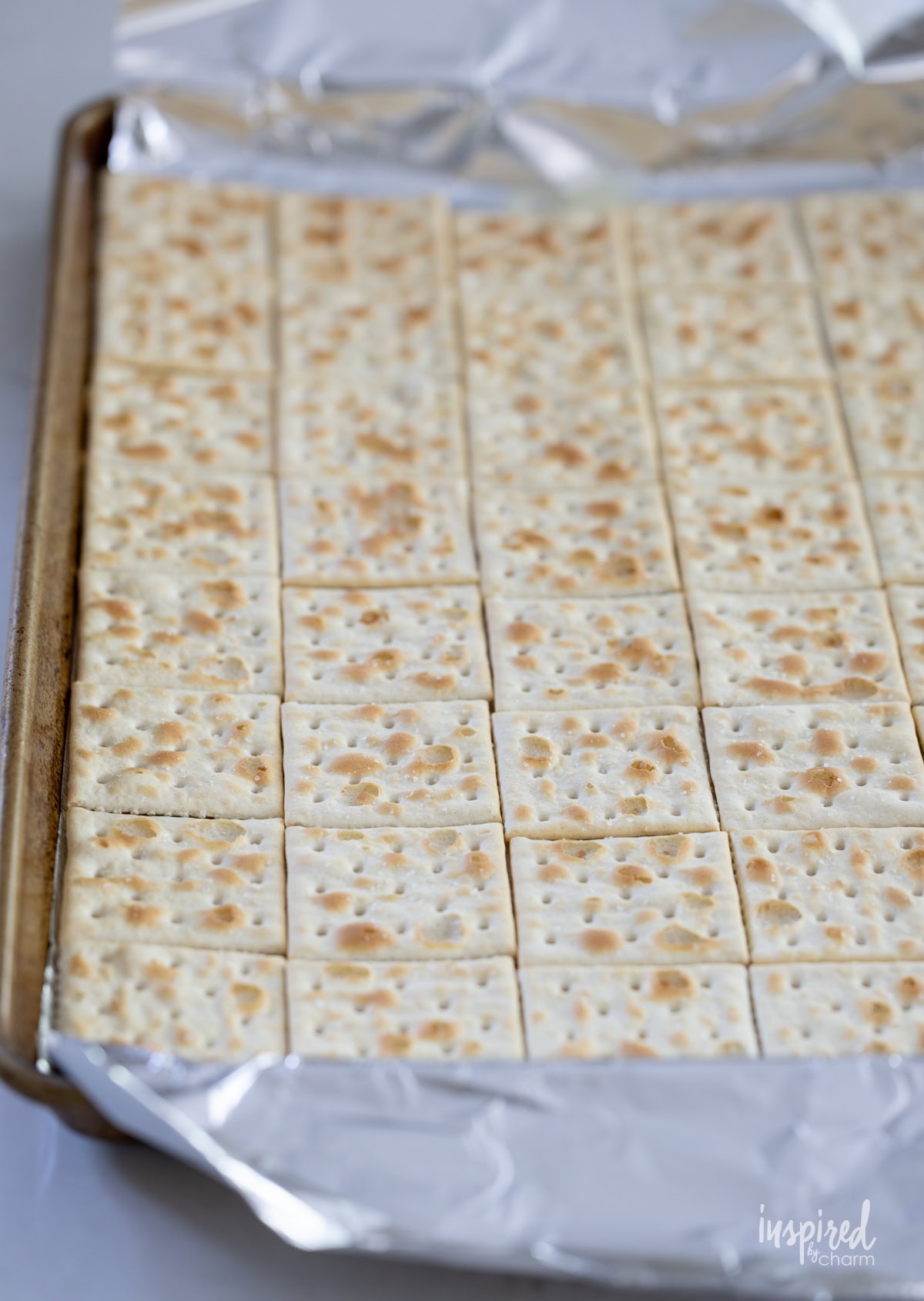 saltine crackers on baking sheet.